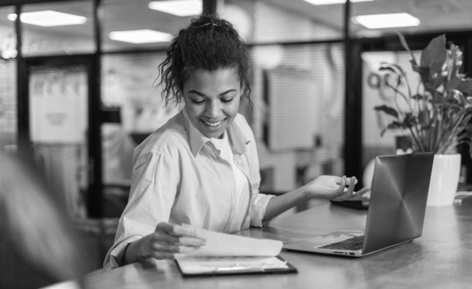 Team members collaborating on budget analysis during an afternoon work session