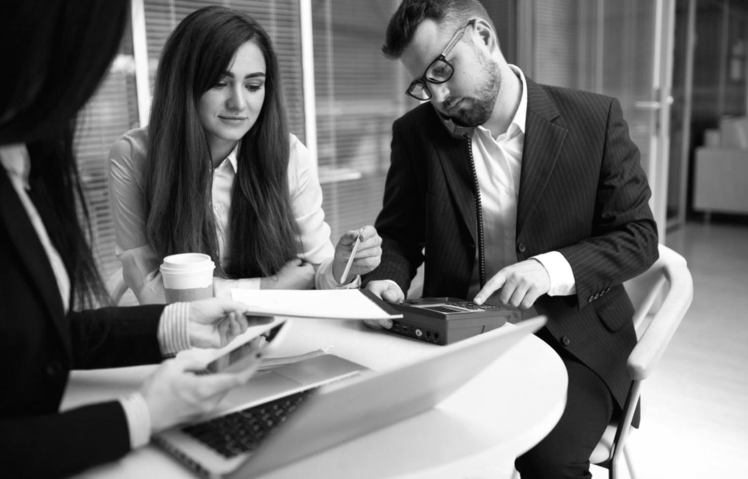 Person reviewing financial documents and planning budget
